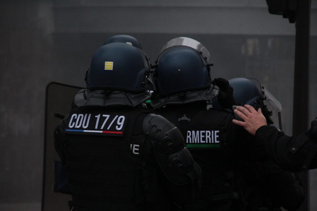Police in riot gear at protest against Ebola quarantine facility