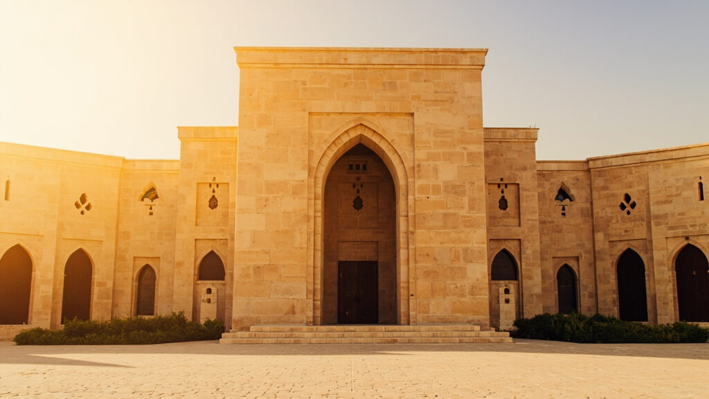 A Saudi government or judicial building exterior with arched doorways and sand-colored stonework under bright midday sun.