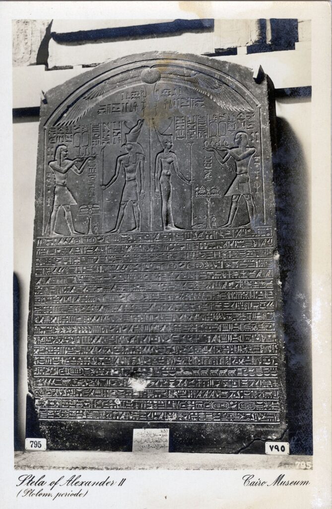 Ancient Egyptian stone artifacts and statuary displayed in a museum gallery during a repatriation handover.