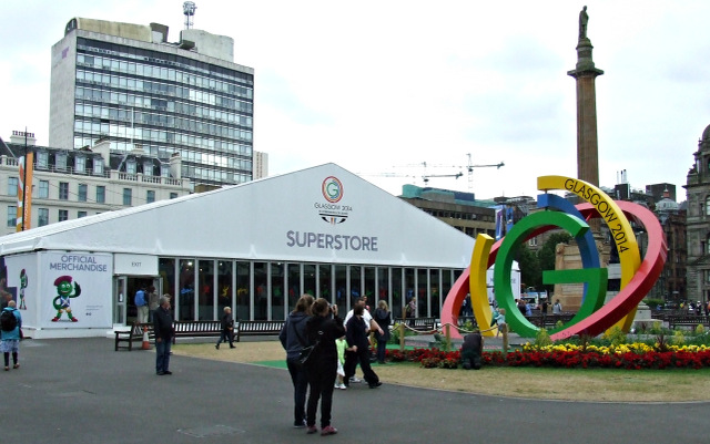 Wide view of an indoor sports arena during the Glasgow 2014 Commonwealth Games, with spectators in the stands.