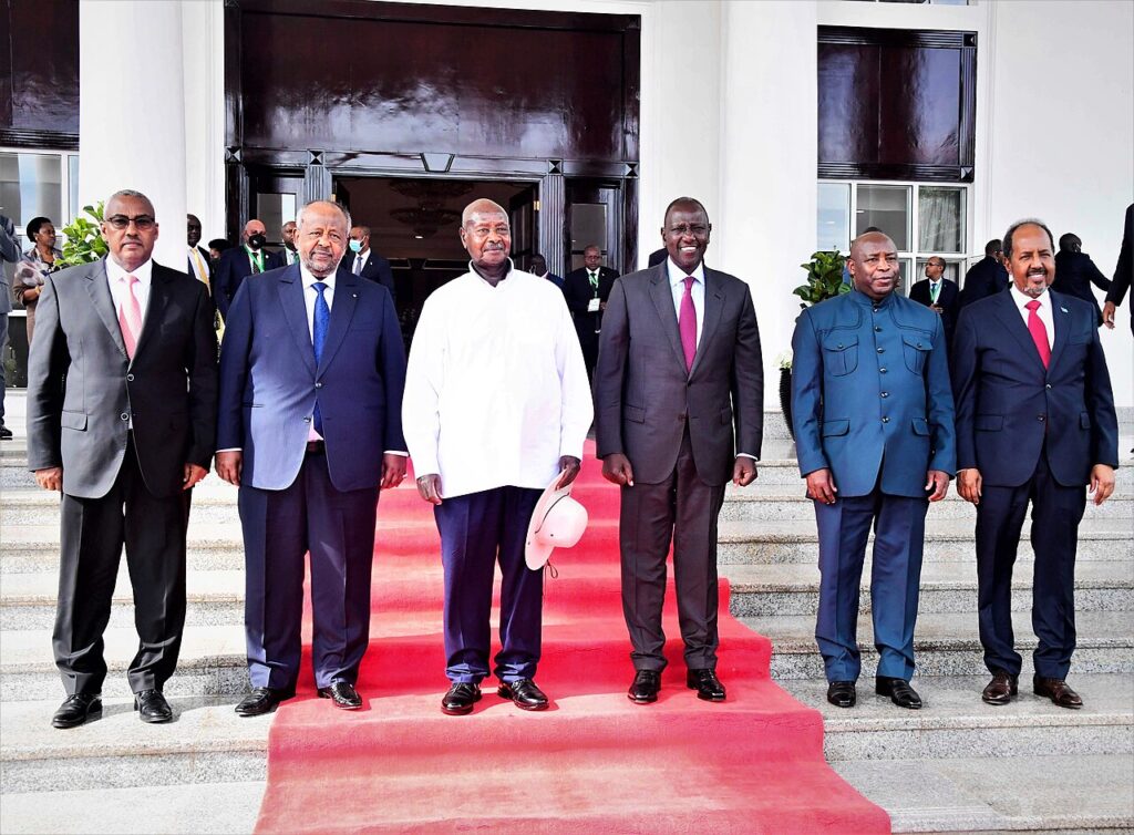 Two African heads of state seated together during bilateral diplomatic talks in an official reception room.